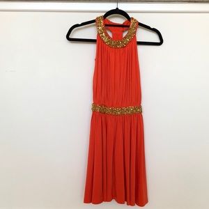 bold orange party dress with gold beading